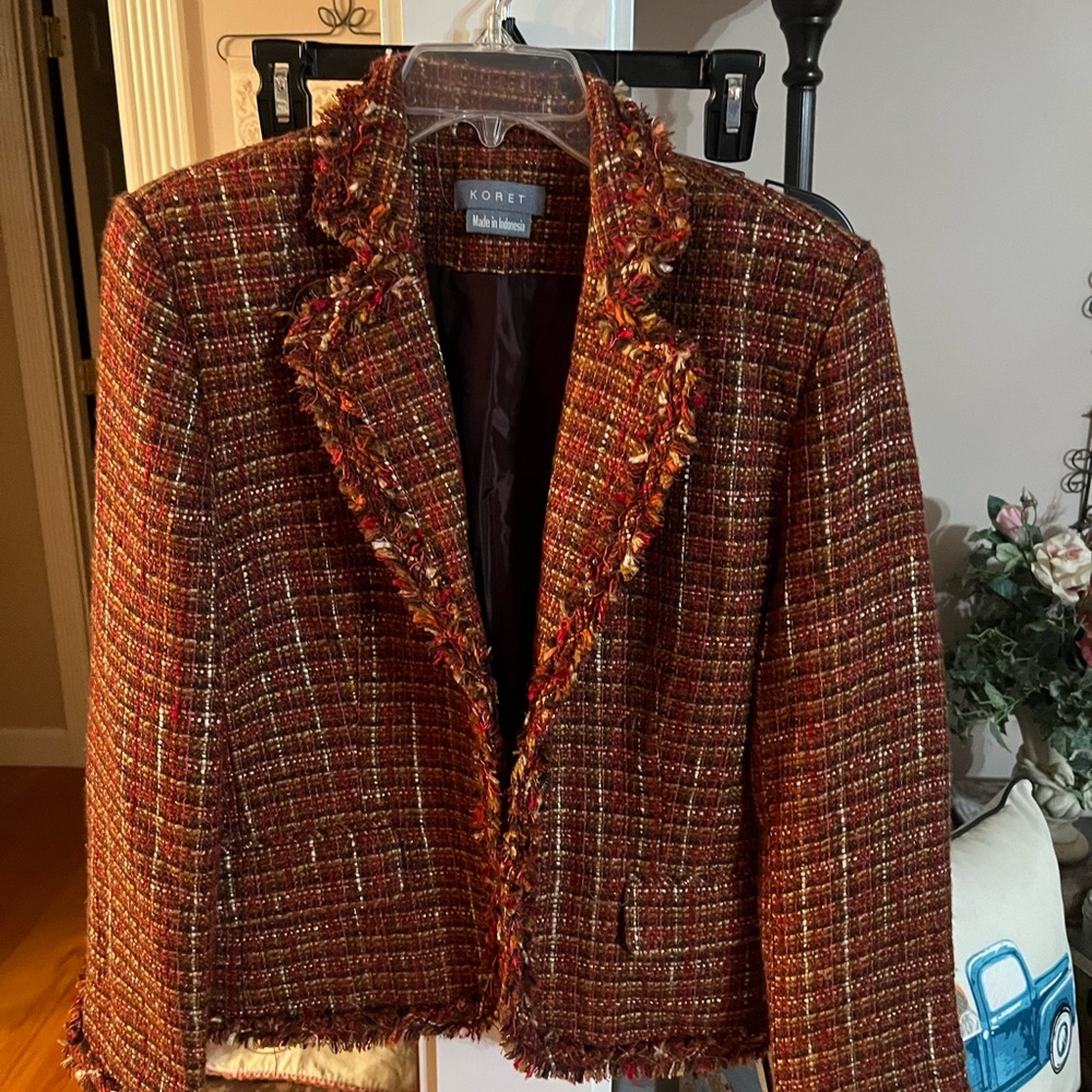 Beautiful multi colored ladies jacket.  Fringe on sleeve and hem.
